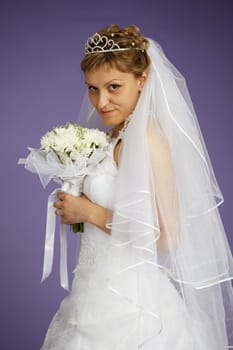 Portrait of a bride with a bouquet of flowers