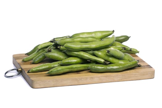 Close up view of some broad beans isolated on a white background.