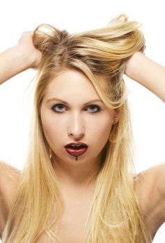 beautiful blonde woman with chocolate covered lips on white background