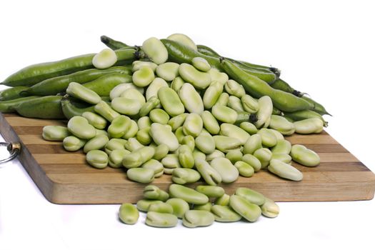 Close up view of some broad beans isolated on a white background.