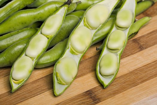 Close up view of some broad beans isolated on a white background.