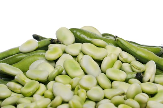 Close up view of some broad beans isolated on a white background.