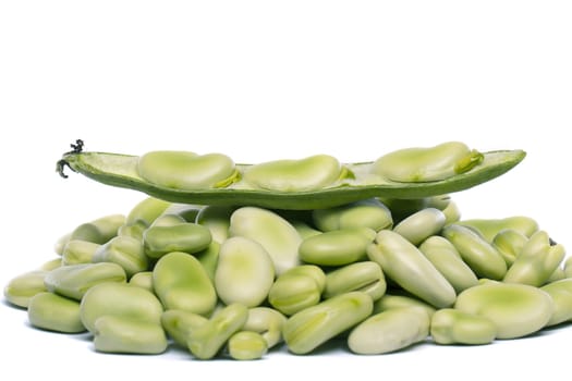 Close up view of some broad beans isolated on a white background.