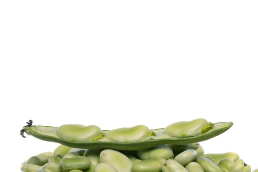 Close up view of some broad beans isolated on a white background.