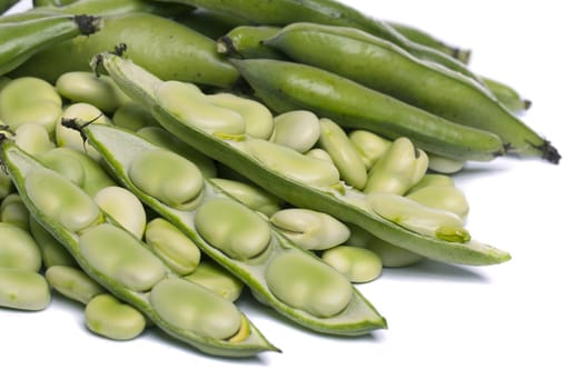 Close up view of some broad beans isolated on a white background.