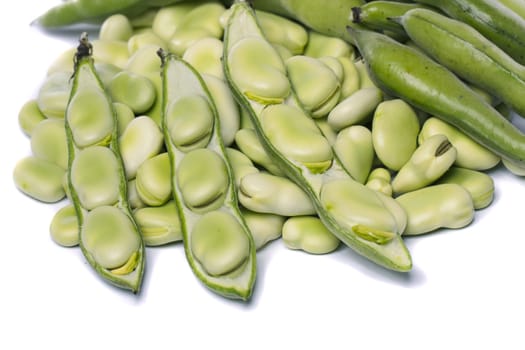 Close up view of some broad beans isolated on a white background.