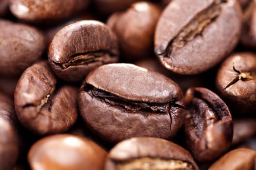 Close up view of a bunch of roasted beans of coffee.