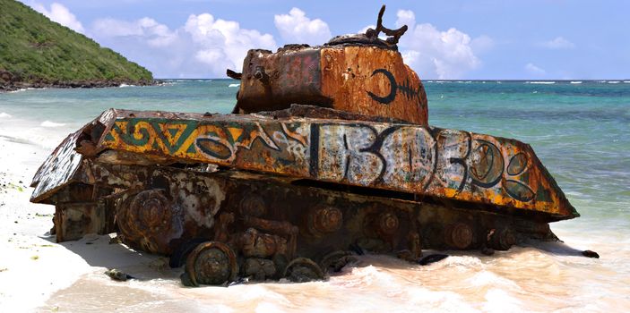 The old rusted and deserted US army tank of Flamenco beach on the Puerto Rican island of Culebra.