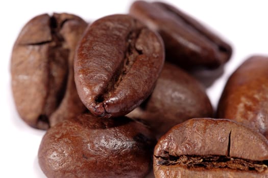 Close up view of a bunch of roasted beans of coffee.