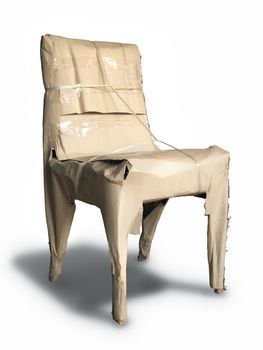 Packing chair with brown crumpled paper  isolated 