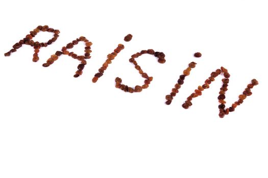 Close view of the word raisin formed by raisins.