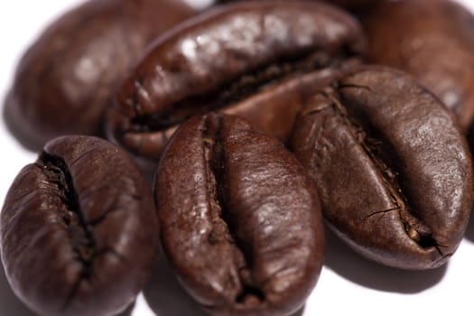 Close up view of a bunch of roasted beans of coffee.