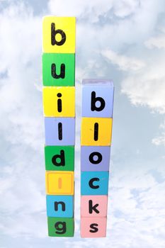 toy letters that spell building blocks with cloudy background and clipping path
