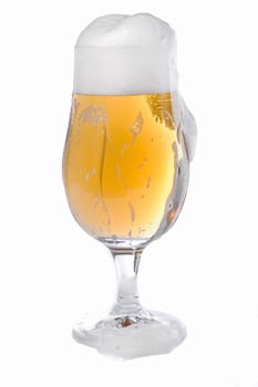 Close view of a glass of beer isolated on a white background.