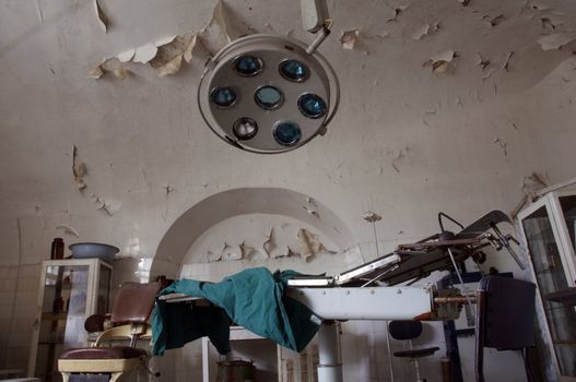 Old and abrased surgery room with equipment