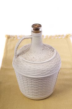 Close up view detail of a 5lt Portuguese wine bottle isolated on a white background.