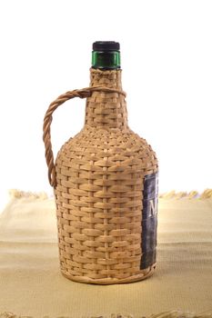 Close up view detail of a 5lt Portuguese wine bottle isolated on a white background.