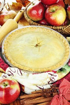 Delicious fresh baked apple pie with ingredients. Perfect for the holidays.