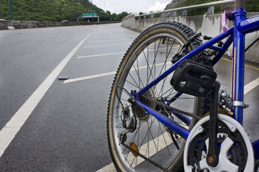 Mountain bicycle on highway at sunny day 