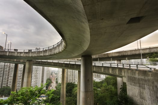 Modern Urban City with Freeway Traffic bridge at day, hong kong 