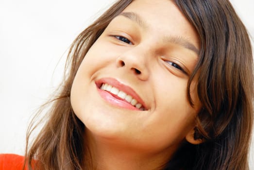 portrait of cheerful long-haired caucasian teenage girl isolated over white background