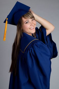 Smiling high school girl graduating