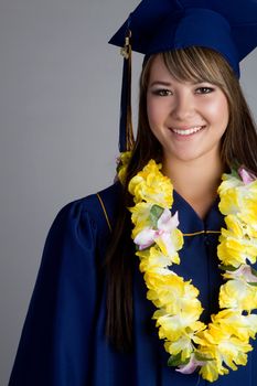Smiling graduation girl wearing lei