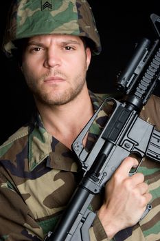 Soldier carrying machine gun