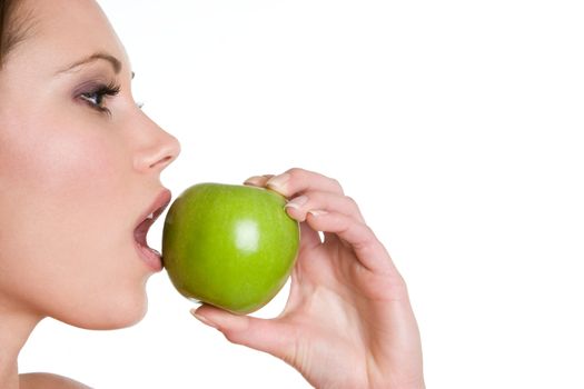 Woman eating green apple