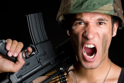 Angry military soldier holding gun