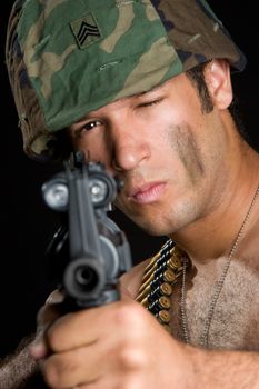 Military man pointing gun