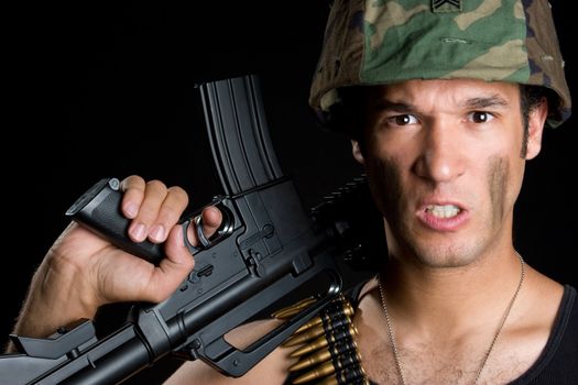 Aggressive soldier man holding gun