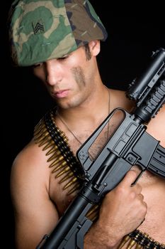 Army man holding machine gun
