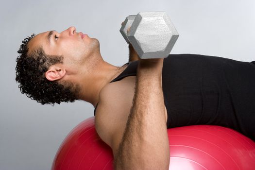 Young fitness man lifting weights