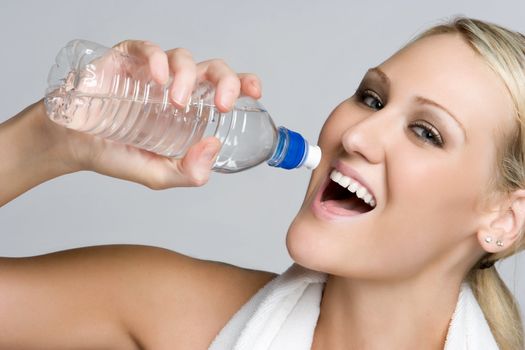 Blond woman drinking water