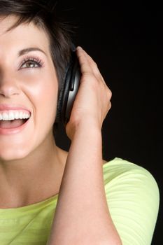 Happy girl listening to headphones