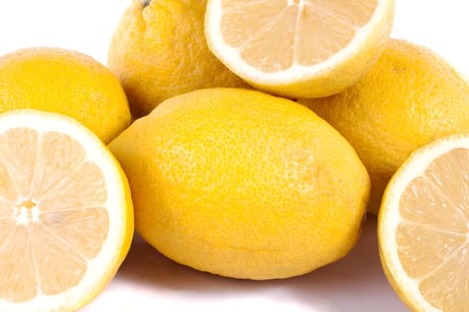 Close up view of bunch of lemons isolated on a white background.