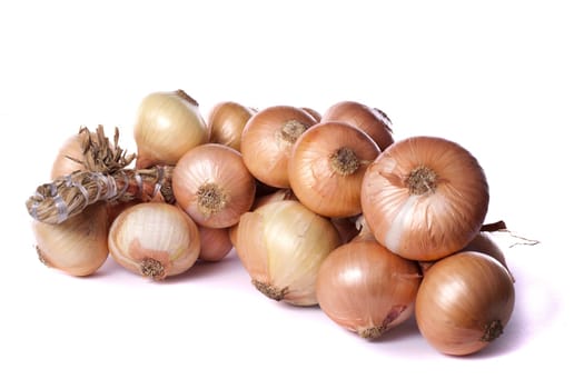 Close up view of a bunch of onions isolated on a white background.