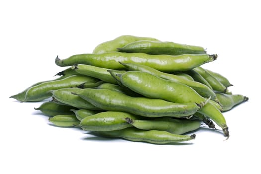 Close up view of some broad beans isolated on a white background.