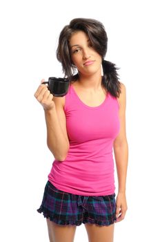 attractive young hispanic woman in PJ's with her morning coffee on a white background
