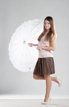 Girl standing with umbrella