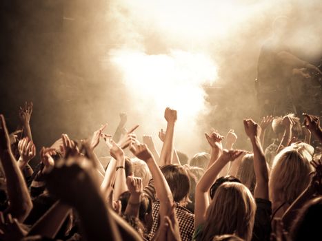 Crowd at a concert, hands up. High ISO!