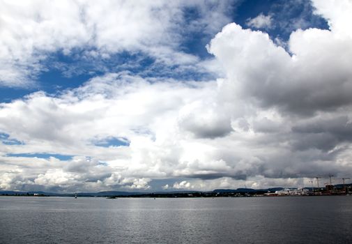 dramatic cloudscape in the harbor of Oslo Norway