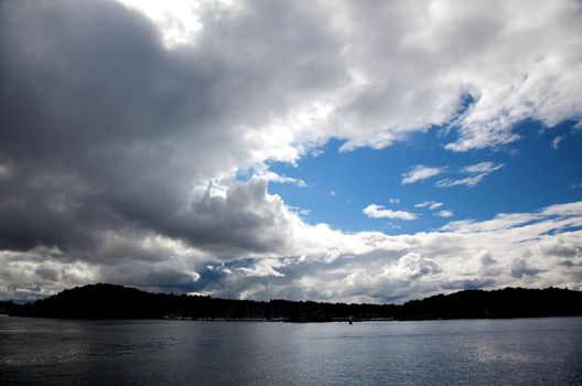 dramatic cloudscape in the harbor of Oslo Norway