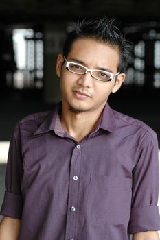 Handsome young Asian male with spectacles