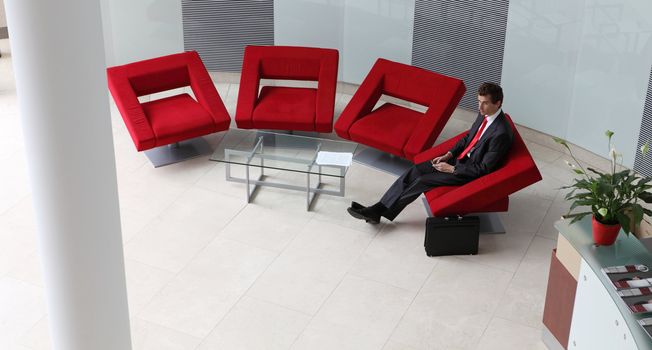 young caucasian businessman sitting in modern office