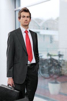 young caucasian businessman at office exterior