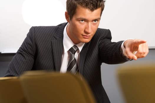 Businessman pointing in office