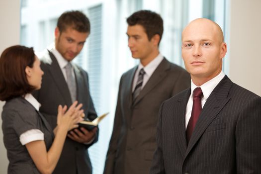 Portrait of young caucasian business people in office