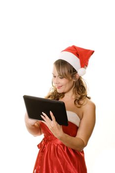 Woman in christmas outfit holding tablet computer isolated on white